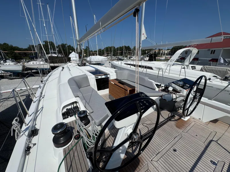 Slide: The Image of 2024 Beneteau First 44 sailboat cockpit with dual steering wheels and modern design. - 9