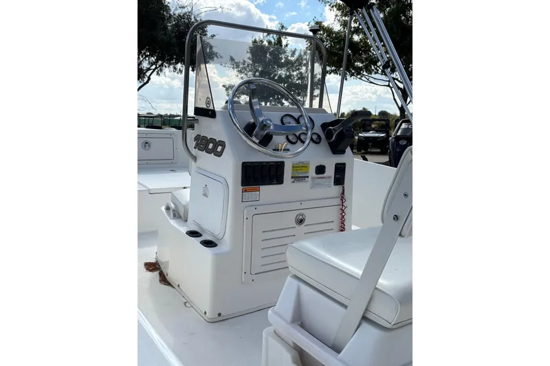 Slide: The Image of 2004 Century 1800 Center Console boat interior with steering wheel and controls. - 3