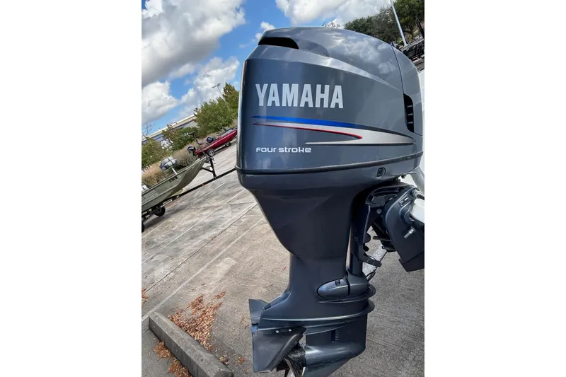 Slide: The Image of Yamaha four-stroke outboard motor on a 2004 Century 1800 Center Console boat. - 5
