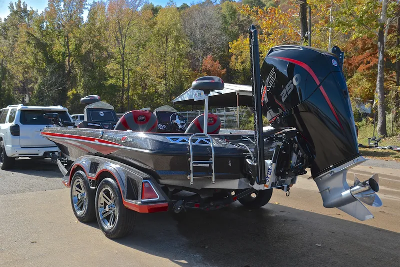 Slide: The Image of 2020 Ranger Z521L boat with powerful engine, parked near autumn trees. - 12