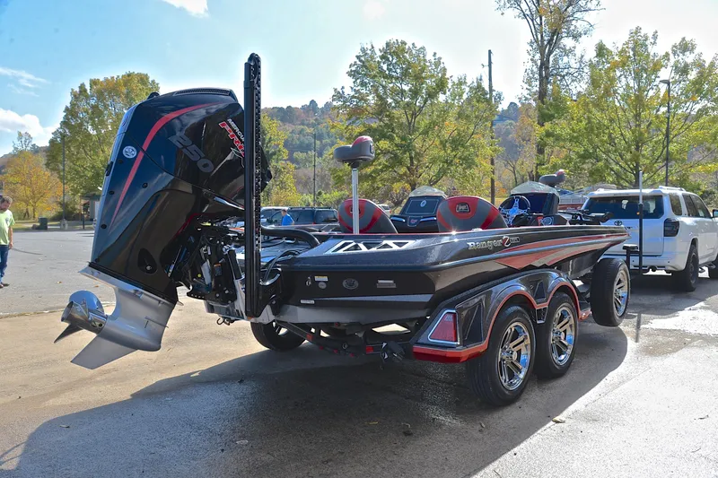 Slide: The Image of 2020 Ranger Z521L boat with powerful outboard motor, parked on a sunny day. - 14