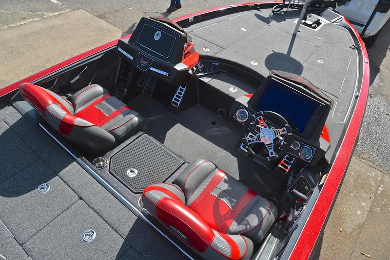 Slide: The Image of 2020 Ranger Z521L boat interior with red and gray seats, modern dashboard, and steering wheel. - 22