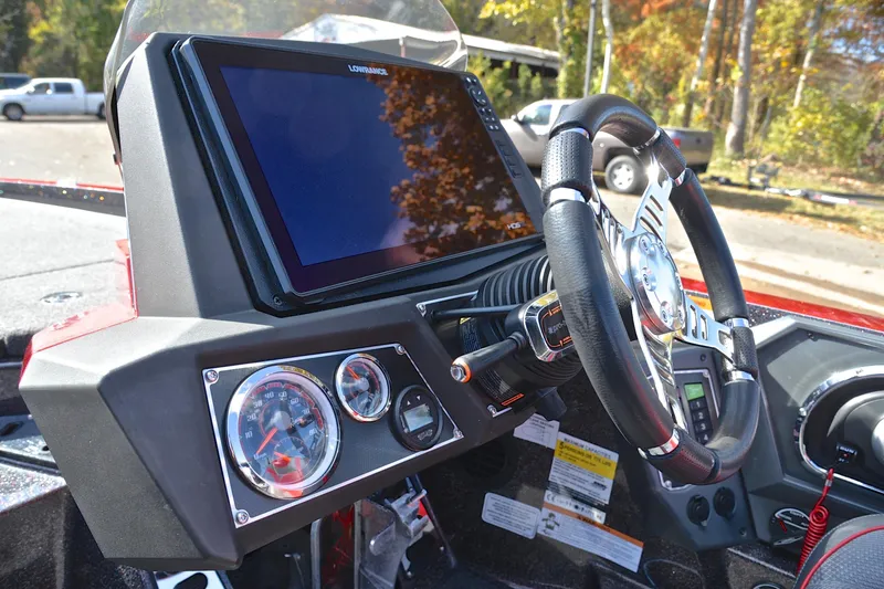 Slide: The Image of 2020 Ranger Z521L boat dashboard with steering wheel and digital display. - 25