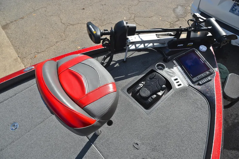 Slide: The Image of 2020 Ranger Z521L boat deck with red and gray seat, control panel, and trolling motor. - 26