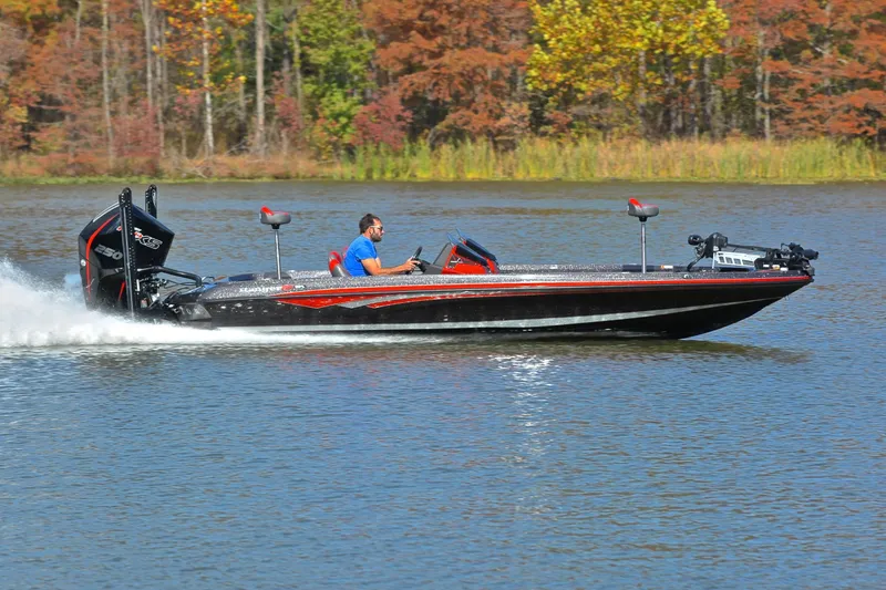 Slide: The Image of 2020 Ranger Z521L boat speeding on a lake with autumn trees in the background. - 3