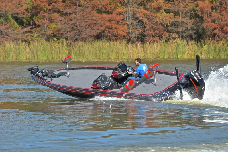 Slide: The Image of 2020 Ranger Z521L boat speeding on a lake with autumn foliage background. - 6