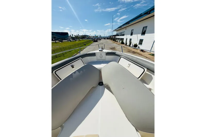 Slide: The Image of 2005 Century 3200 Center Console boat interior with seating and storage compartments. - 10