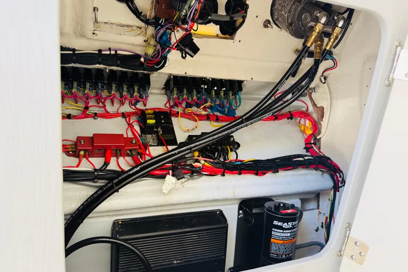 Slide: The Image of Electrical wiring and components inside a 2005 Century 3200 Center Console boat. - 13