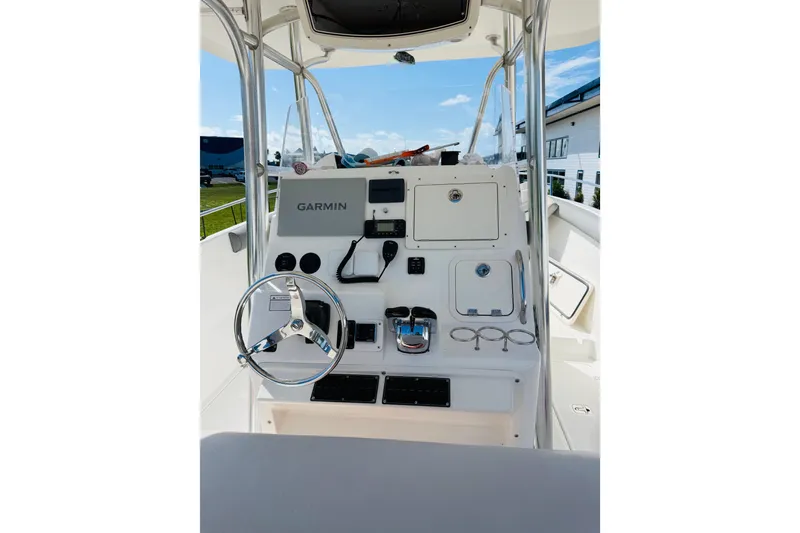 Slide: The Image of Century 3200 Center Console 2005 boat dashboard with Garmin navigation system. - 6