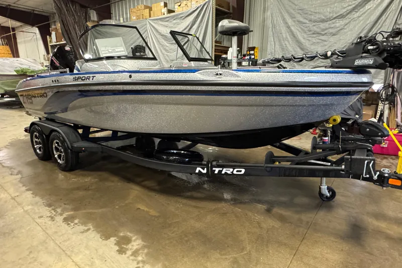 Slide: The Image of 2026 Nitro ZV19 Sport Pro boat on trailer in a warehouse setting. - 0
