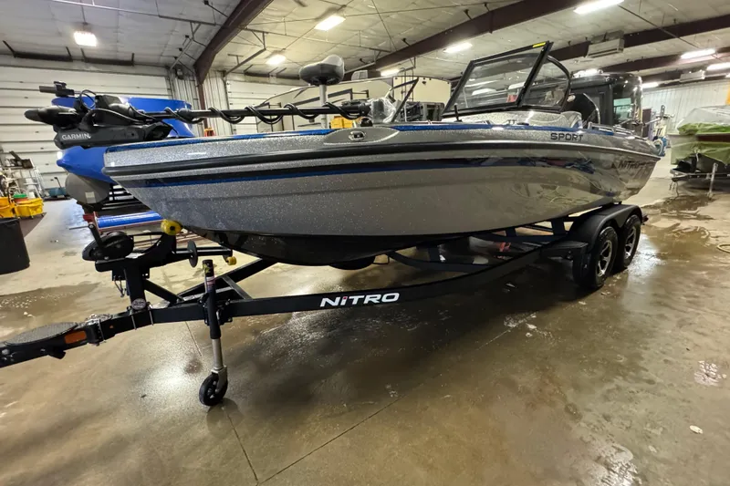 Slide: The Image of 2026 Nitro ZV19 Sport Pro boat on trailer in indoor facility. - 1