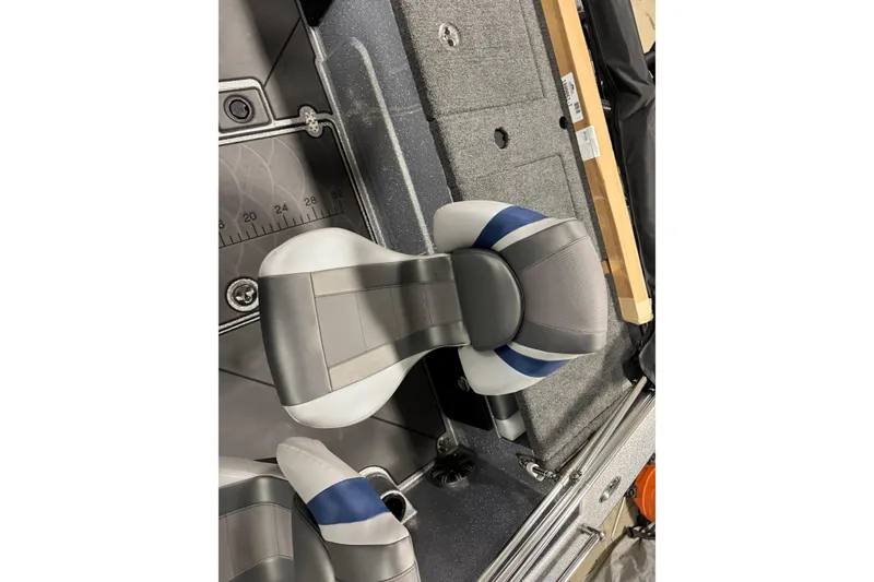 Slide: The Image of 2026 Nitro ZV19 Sport Pro boat interior with gray and blue seating. - 13