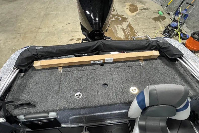 Slide: The Image of 2026 Nitro ZV19 Sport Pro boat interior with carpeted deck and seating. - 14