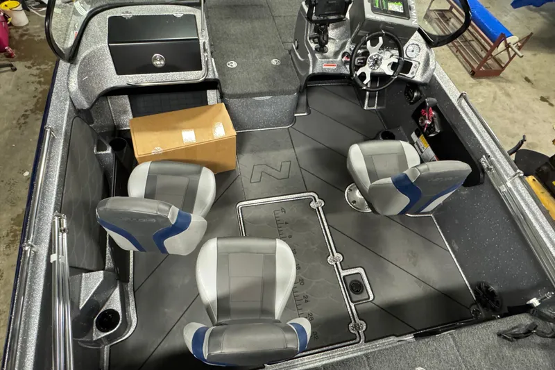 Slide: The Image of 2026 Nitro ZV19 Sport Pro boat interior with four seats and a cardboard box. - 15