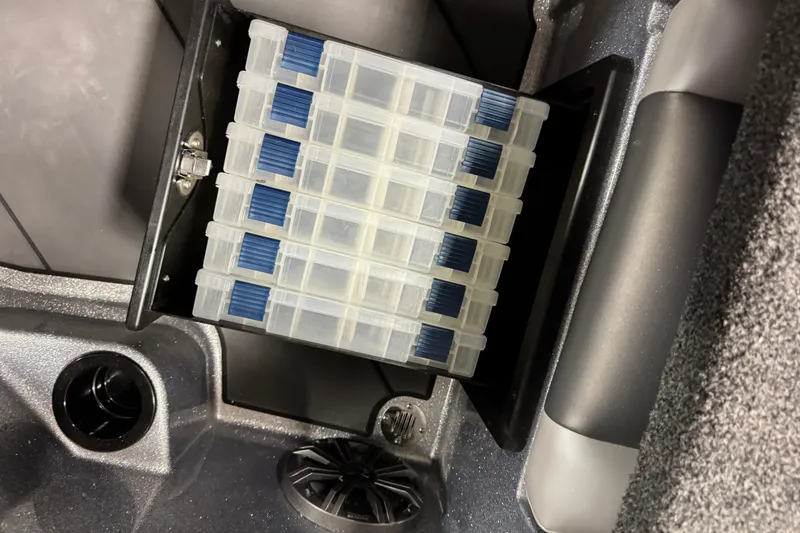 Slide: The Image of Storage compartment in 2026 Nitro ZV19 Sport Pro boat with organized tackle boxes. - 19