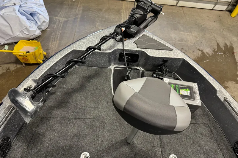Slide: The Image of Front deck of 2026 Nitro ZV19 Sport Pro boat with trolling motor and seat. - 23