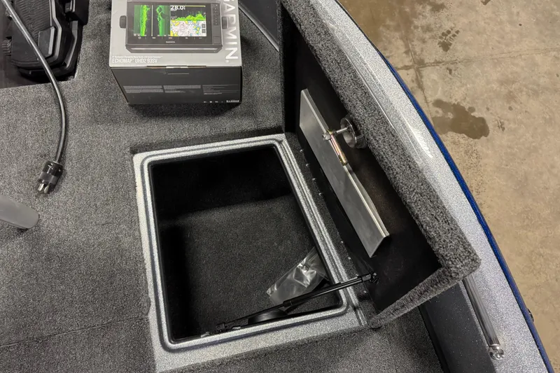 Slide: The Image of 2026 Nitro ZV19 Sport Pro boat storage compartment with Garmin ECHOMAP UHD 93SV box. - 28