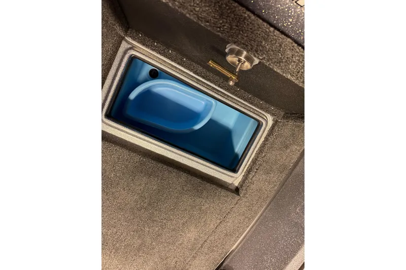 Slide: The Image of 2026 Nitro ZV19 Sport Pro boat compartment with blue interior and metallic latch. - 30