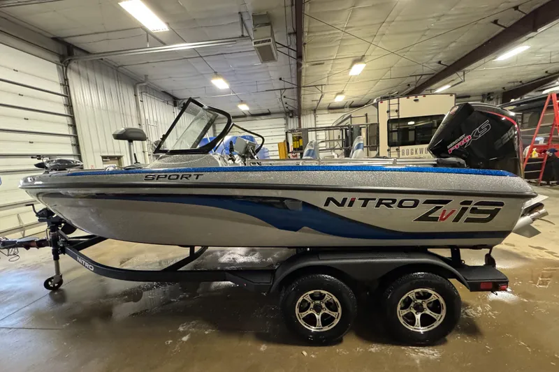 Slide: The Image of 2026 Nitro ZV19 Sport Pro boat in a garage setting. - 4
