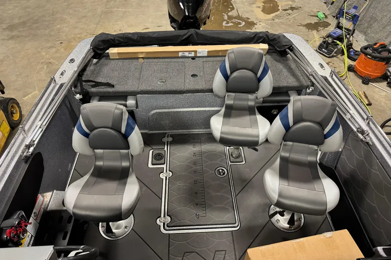 Slide: The Image of Interior of 2026 Nitro ZV19 Sport Pro boat with four gray and blue seats. - 7