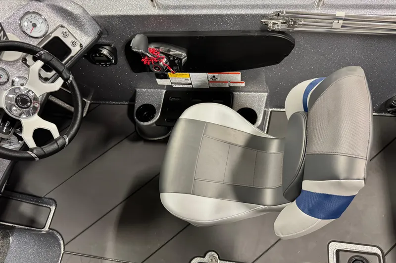 Slide: The Image of Interior of 2026 Nitro ZV19 Sport Pro boat with steering wheel and seat. - 8