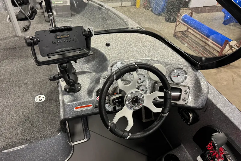 Slide: The Image of 2026 Nitro ZV19 Sport Pro boat dashboard with steering wheel and Garmin mount. - 9