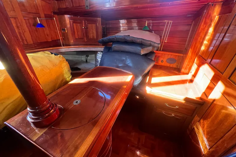 Slide: The Image of Interior of 1966 Moody Salar Motorsailer, featuring polished wood and cozy seating area. - 14