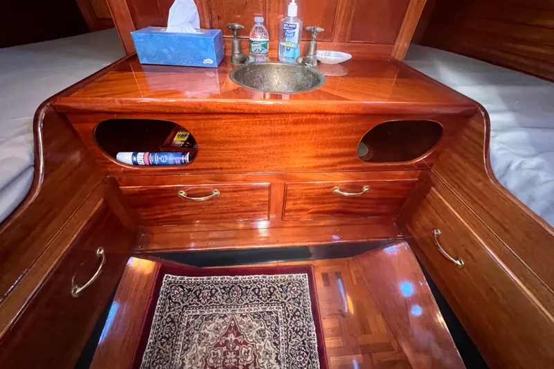 Slide: The Image of Luxurious wooden interior of 1966 Moody Salar Motorsailer with sink and storage. - 19