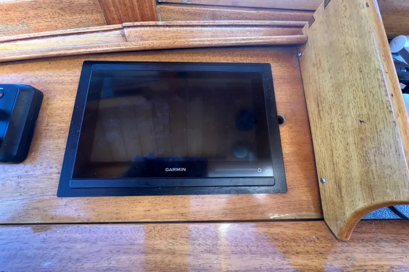 Slide: The Image of Garmin navigation display on 1966 Moody Cutter wooden dashboard. - 24