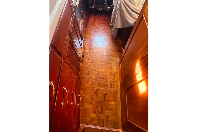 Slide: The Image of Wooden interior of 1966 Moody Salar Motorsailer, featuring parquet flooring and polished cabinetry. - 26