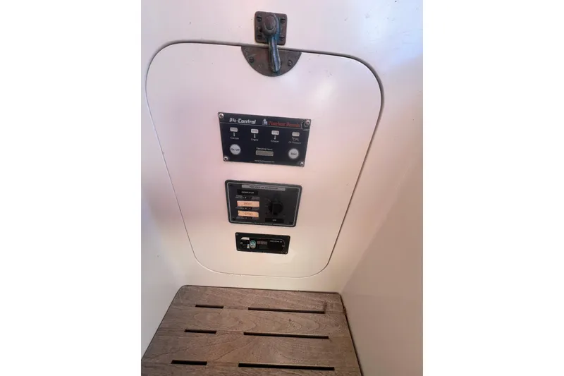 Slide: The Image of Control panel inside 1966 Moody Cutter boat with wooden seat. - 27