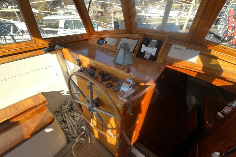 Slide: The Image of 1966 Moody Cutter boat helm with wooden dashboard and steering wheel. - 3