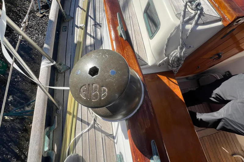 Slide: The Image of Deck of 1966 Moody Cutter sailboat featuring a Gibb winch and wooden details. - 36