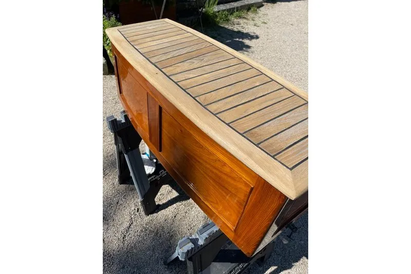 Slide: The Image of Restored 1966 Moody Cutter boat deck with wooden finish on sawhorses. - 38