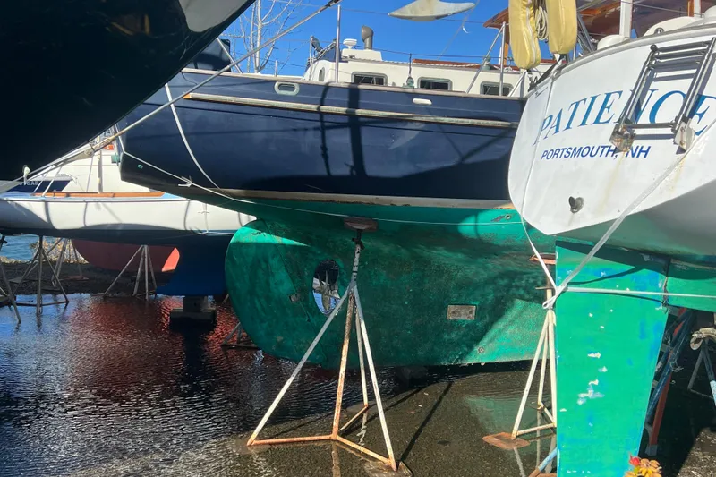 Slide: The Image of Sailboats in dry dock, including a 1966 Moody Cutter, Portsmouth, NH. - 41
