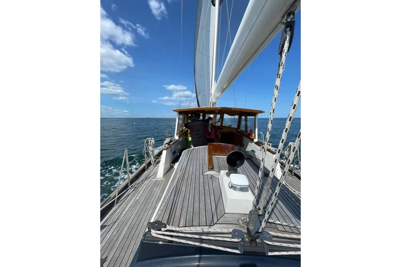 Slide: The Image of 1966 Moody Salar Motorsailer with Cutter Rig sailing on open sea under blue sky. - 43