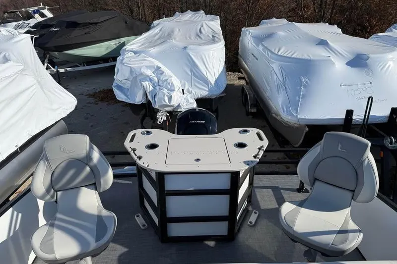 Slide: The Image of 2026 Lowe SF 232 Sport Fish boat with covered vessels in storage. - 10
