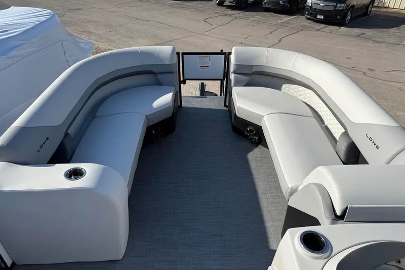 Slide: The Image of 2026 Lowe SF 232 Sport Fish boat interior with gray seating and cup holders. - 15