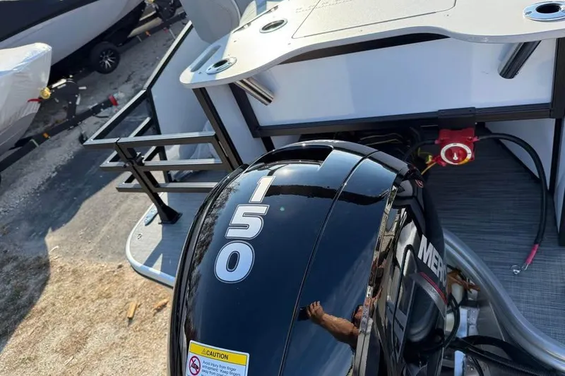 Slide: The Image of 2026 Lowe SF 232 Sport Fish boat with a 150 horsepower Mercury outboard motor. - 8