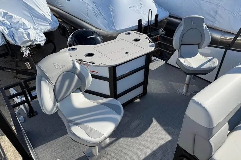 Slide: The Image of 2026 Lowe SF 232 Sport Fish boat interior with seating and fishing station. - 9