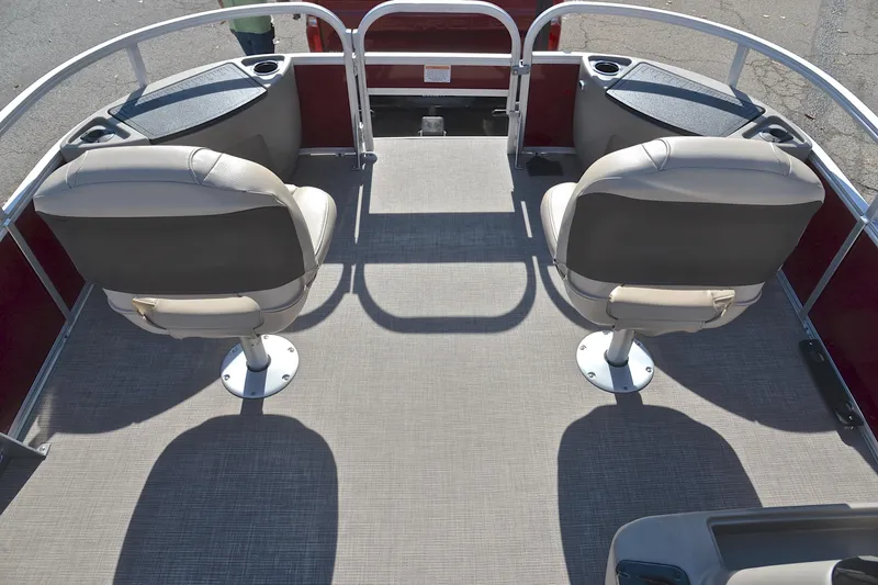 Slide: The Image of 2023 Sun Tracker Bass Buggy 18 DLX pontoon boat interior with two swivel seats. - 21