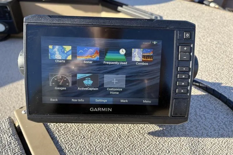 Slide: The Image of Garmin navigation system on 2025 SeaArk DXS 1548 DKLD boat dashboard. - 10