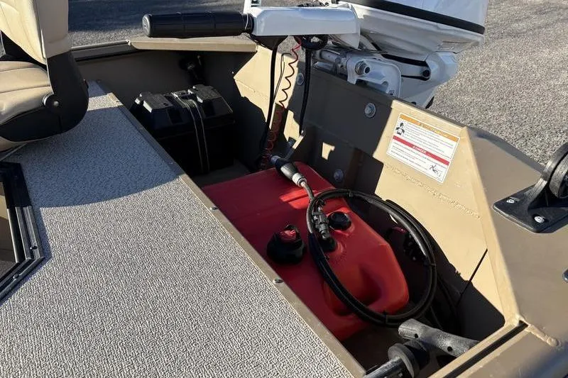 Slide: The Image of 2025 SeaArk DXS 1548 DKLD boat interior with battery and fuel tank setup. - 8