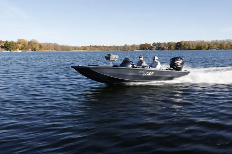Slide: The Image of 2026 Smoker Craft Viper 175 Pro boat cruising on a scenic lake. - 12