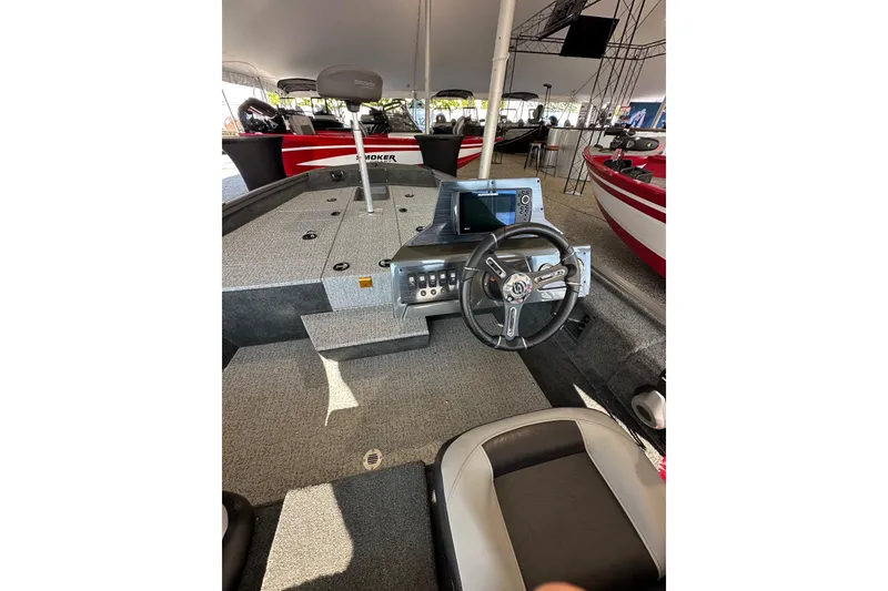 Slide: The Image of 2026 Smoker Craft VIPER 175 boat with Yamaha engine displayed under a tent. - 5
