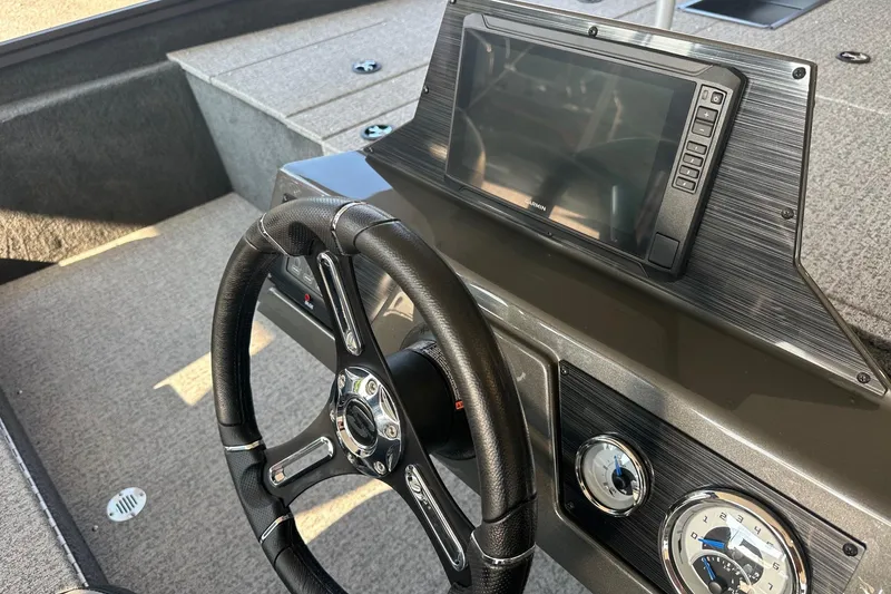 Slide: The Image of 2026 Smoker Craft VIPER 175 boat interior with steering wheel and control panel. - 8