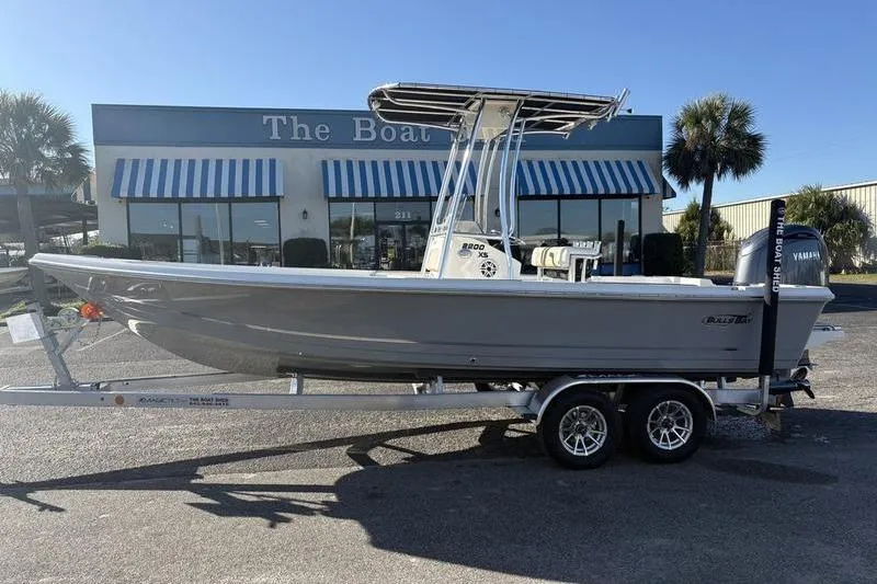 The Image of 2026 Bulls Bay 2200 XS boat on trailer outside dealership. - 0
