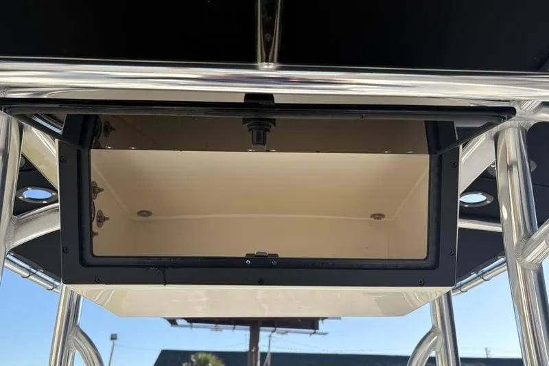 Slide: The Image of 2026 Bulls Bay 2200 XS boat storage compartment with stainless steel frame. - 15