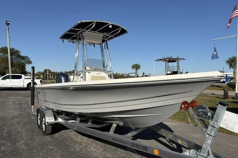 Slide: The Image of 2026 Bulls Bay 2200 XS boat on trailer, parked outdoors under clear blue sky. - 5
