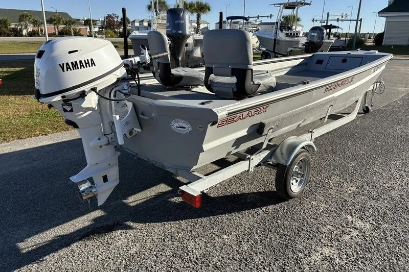 Slide: The Image of 2025 SeaArk DXS 1548 DKLD boat with Yamaha outboard motor on trailer. - 5
